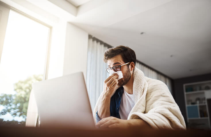 Man With Allergies Working At Home