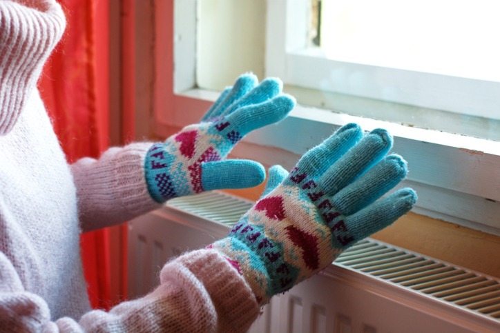 Hands Over Radiator